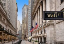 Dow Surges Past 52,000 Milestone Amid Iran Peace Deal Optimism and Fed Rate Decision Dow Surges Past 52,000 Milestone Amid Iran Peace Deal Optimism and Fed Rate Decision